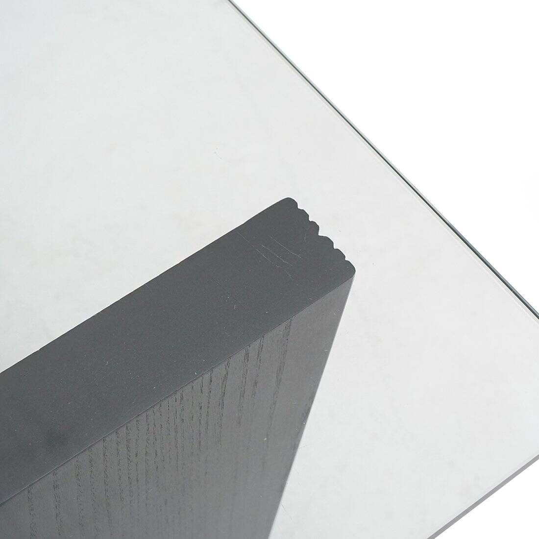 Coffee table with a glass top and black stained wood frame, 1930s.