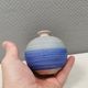A small, round, beautiful ceramic vase from Denmark, dating from the 1980s.