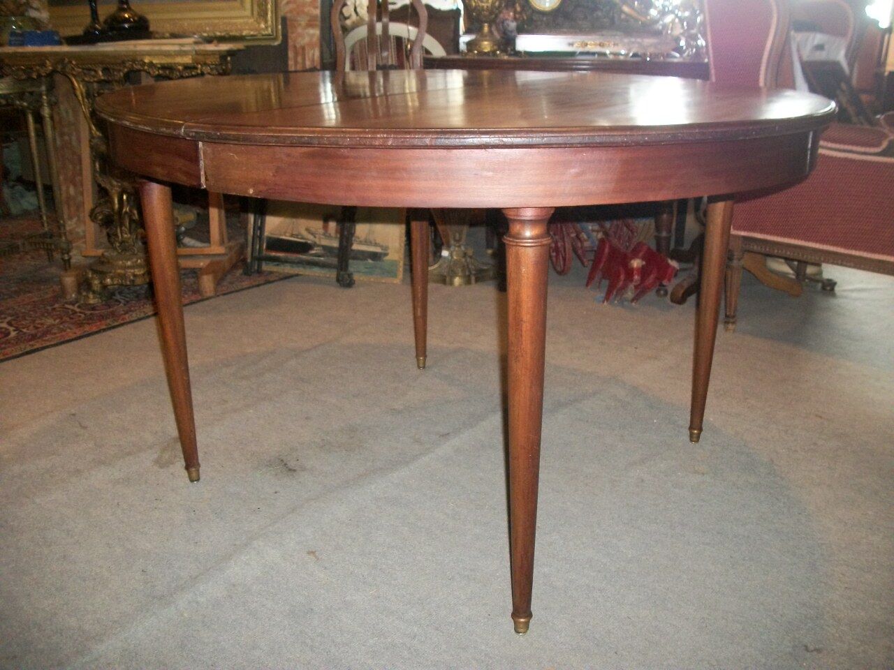 Oval mahogany table with extension cords