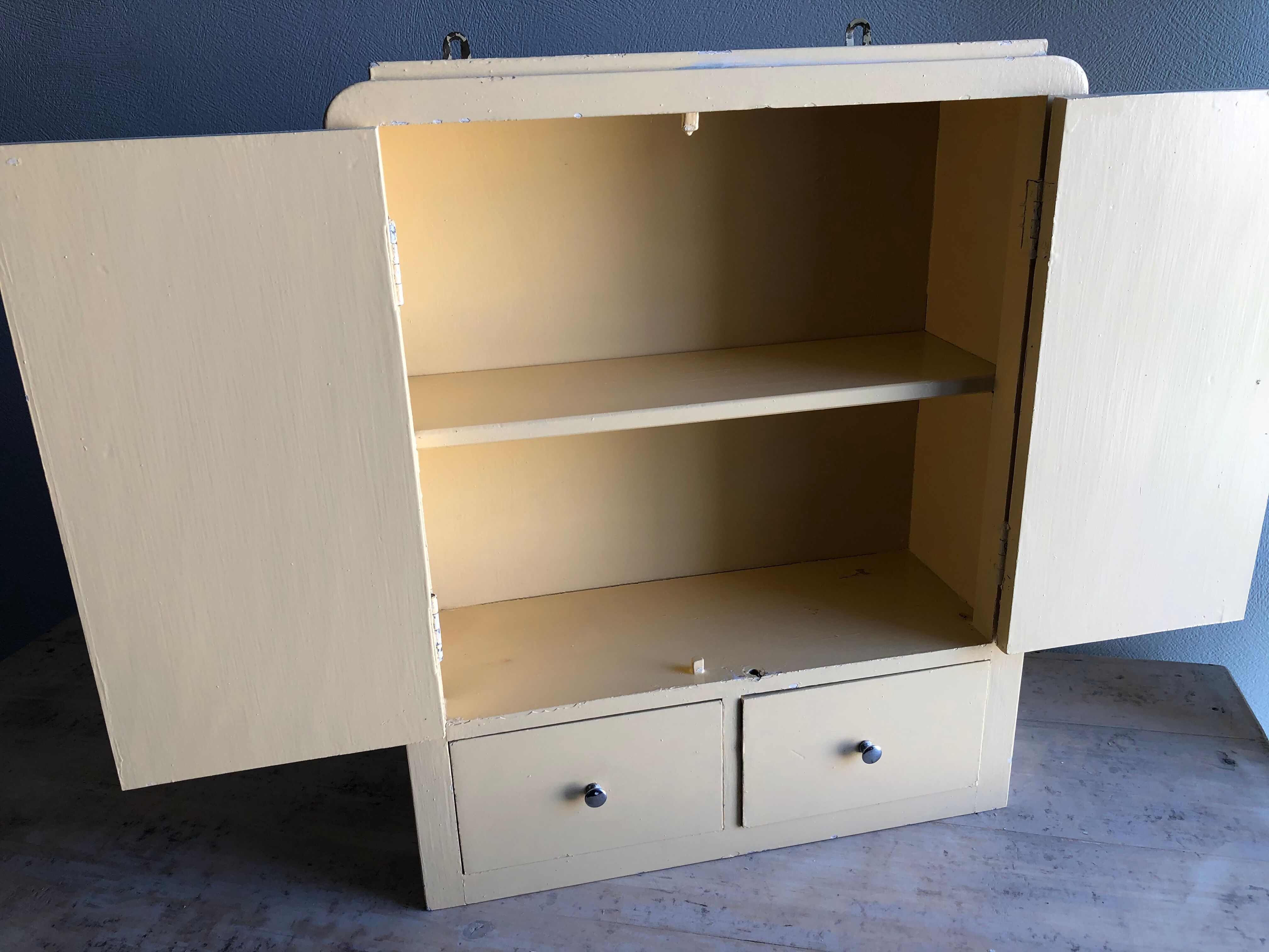 Weathered toilet cabinet