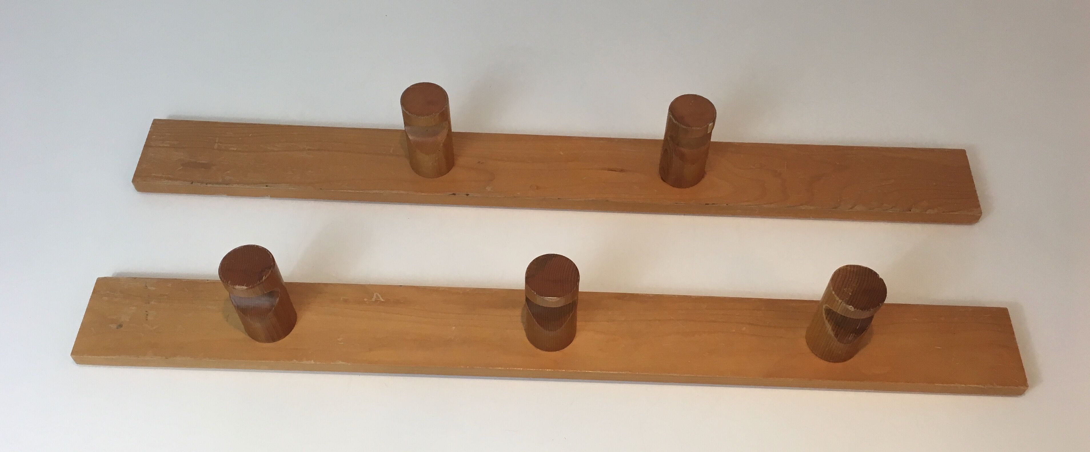 Charlotte Perriand, pair of fir wall coat racks, French work, around 1970