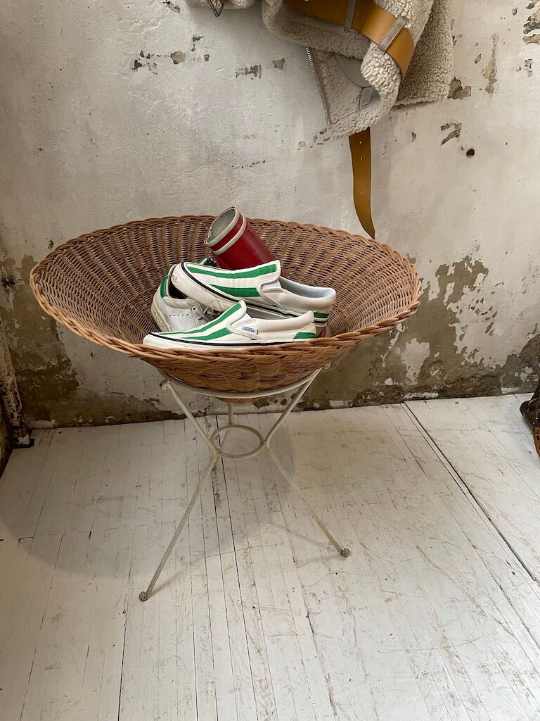 Wicker garden basket on tripod support