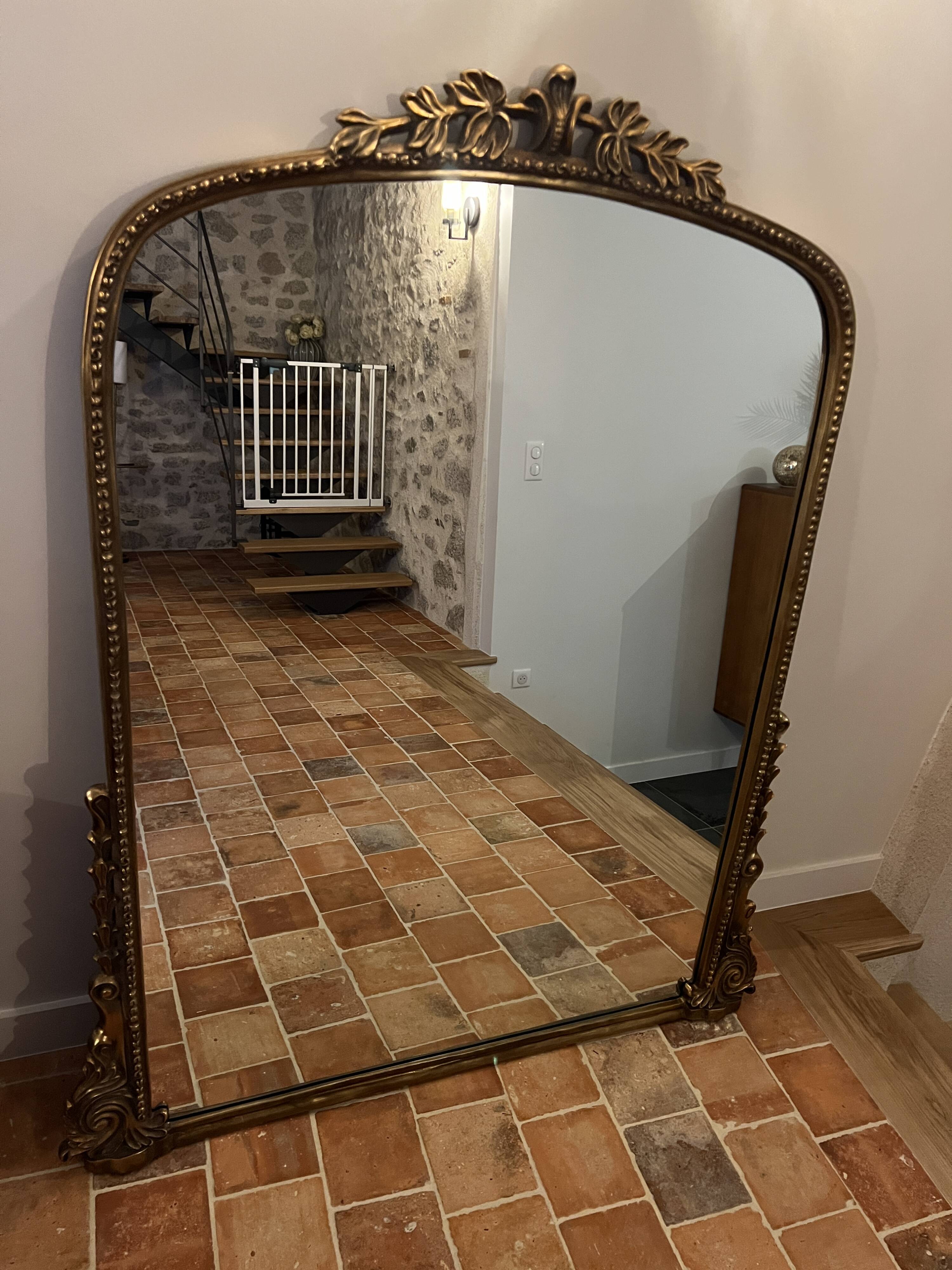 Large gilded mirror with pediment