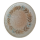 Speckled stoneware plate with floral decoration