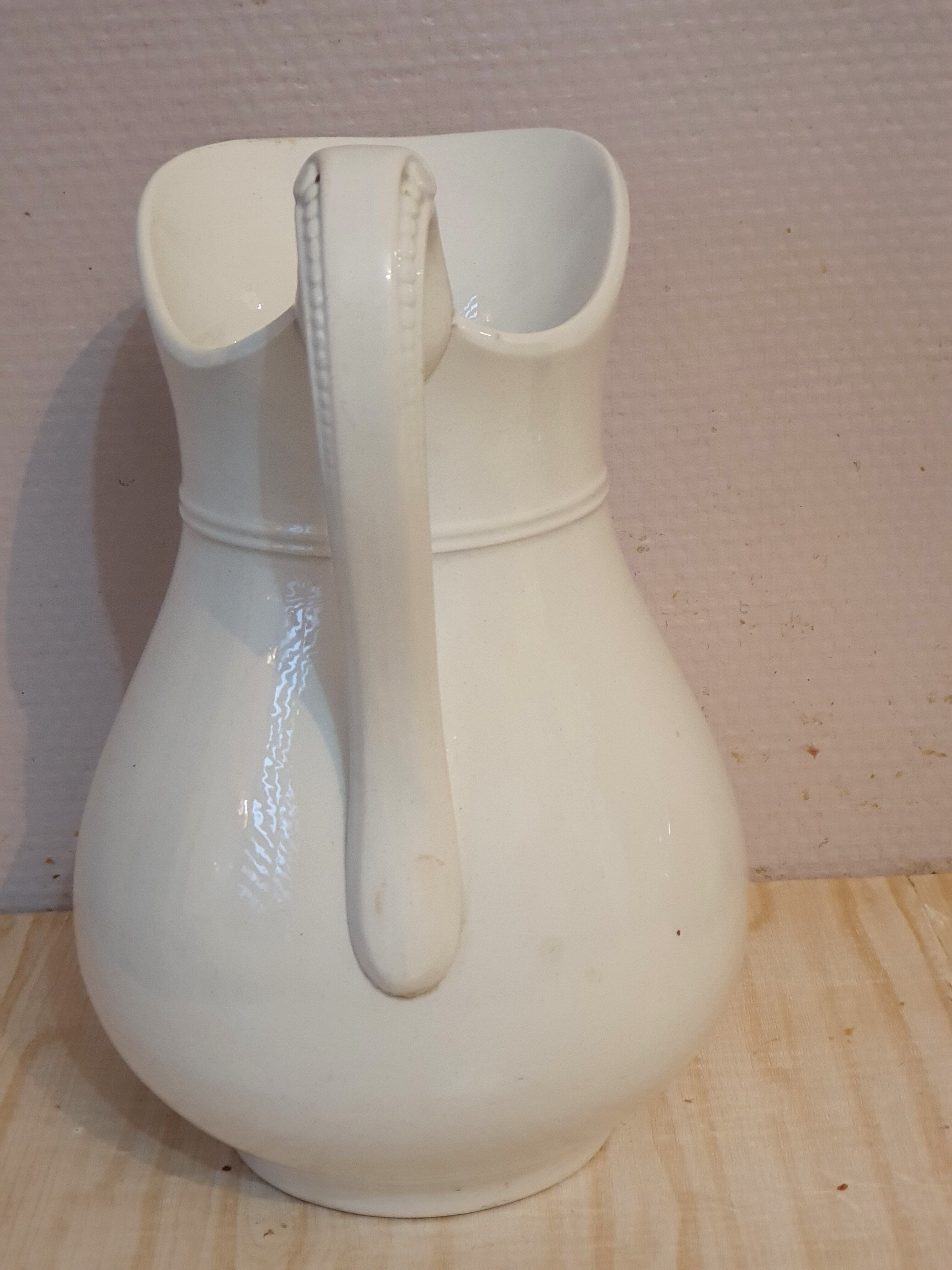 Antique pitcher pitcher in white porcelain