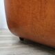 2 fauteuils en cuir cognac, années 1970