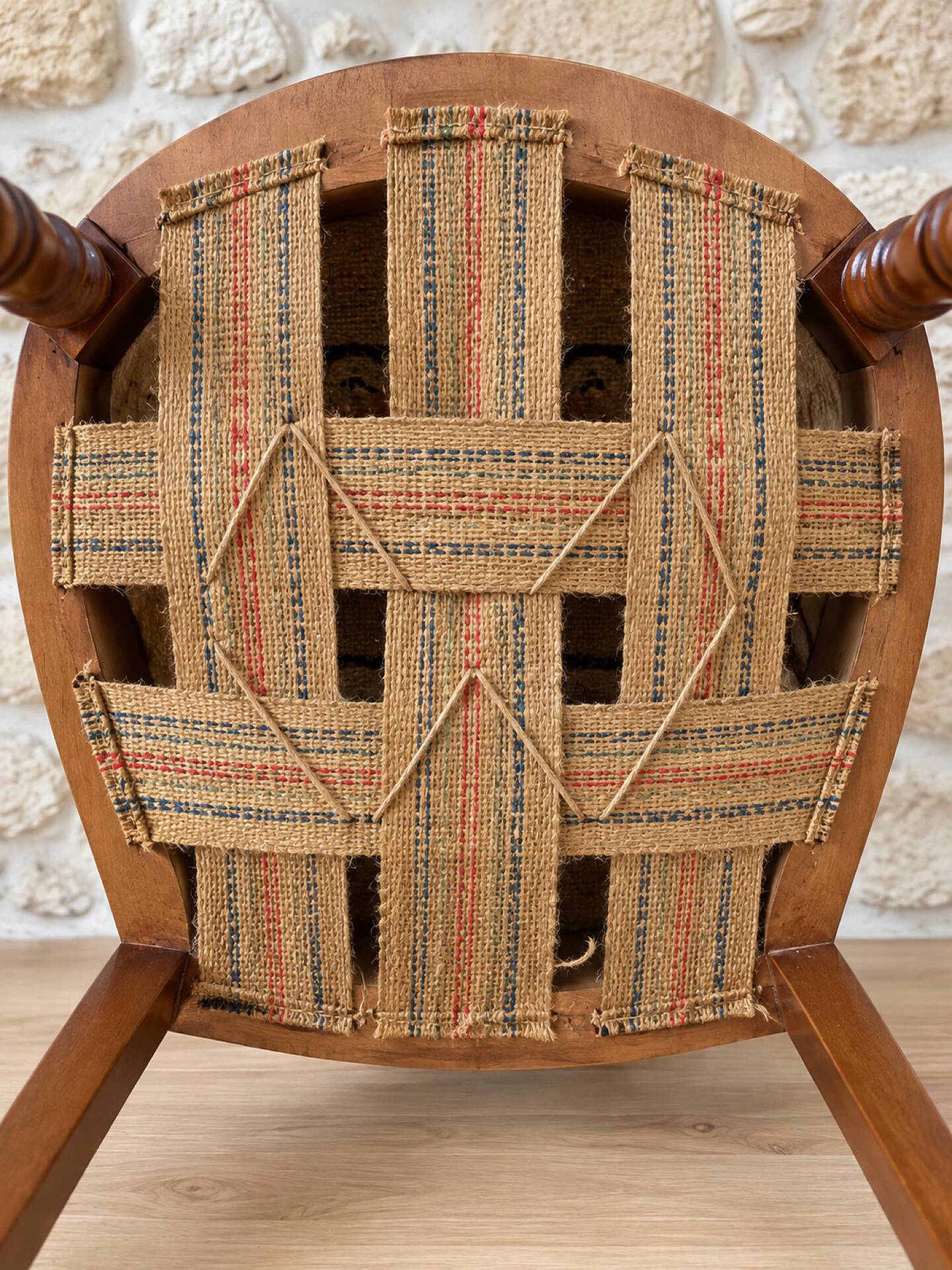 Antique Louis XVI style chair in wood and floral fabric.