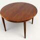 Table ronde de repas extensible danoise en teck – Années 1960