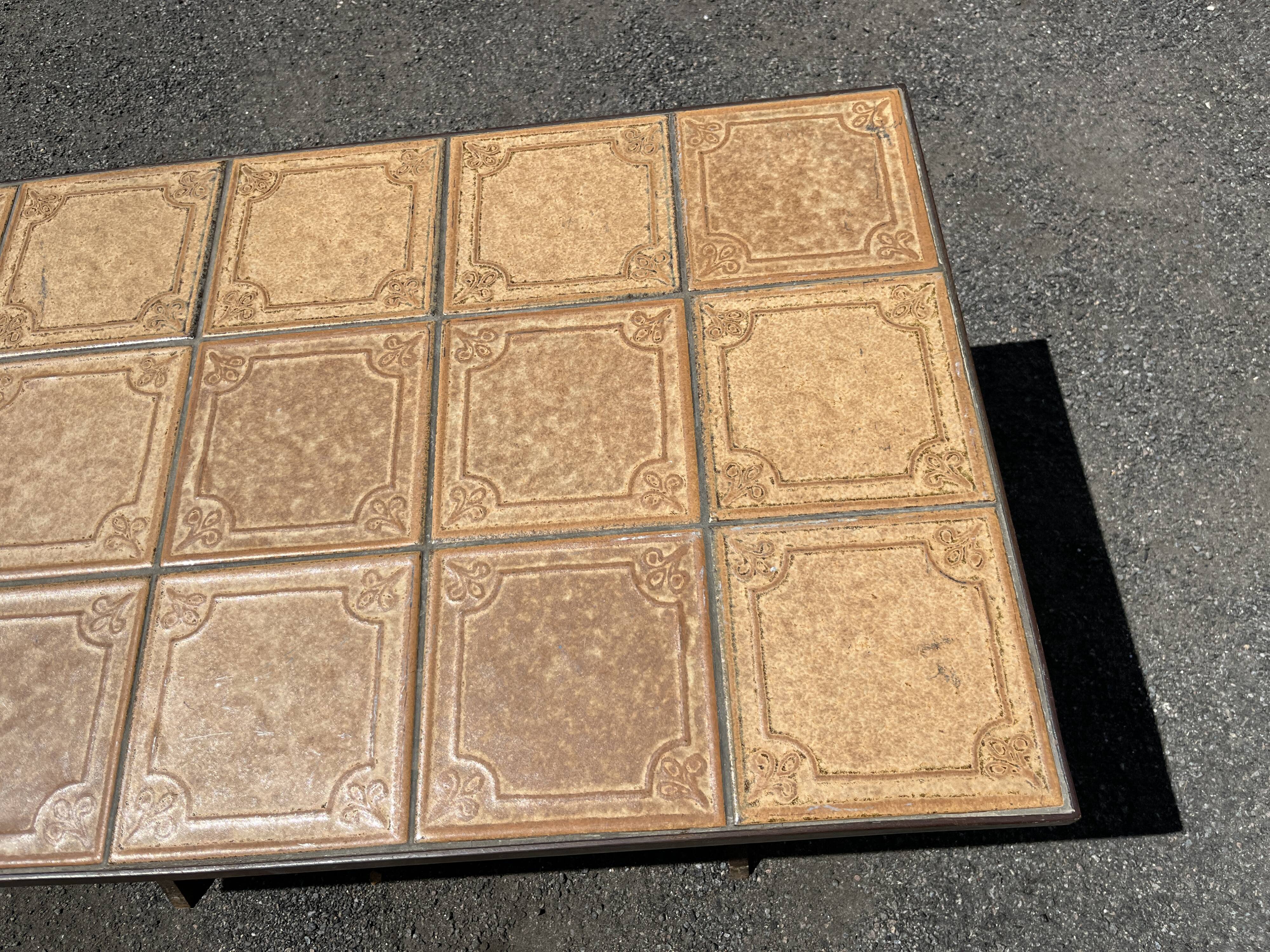 Vintage garden table with ceramic tile top and wrought iron base