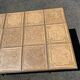 Vintage garden table with ceramic tile top and wrought iron base