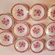 set of 11 vintage soup plates with red flowers