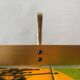 Vintage wall-mounted coat rack in golden aluminum - triple coat hook