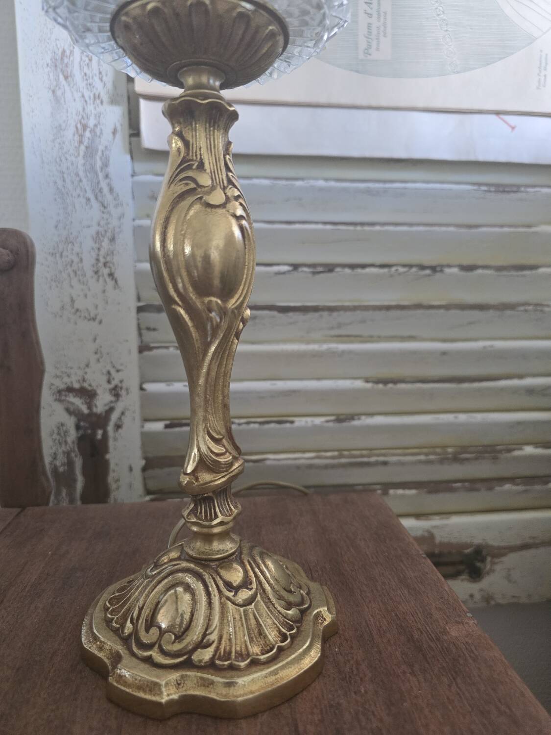 Vintage table lamp with a bronze base and moulded glass globe.