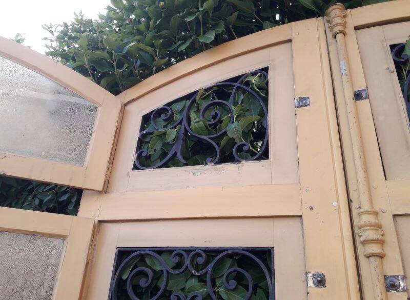 19th century double arched entrance door in oak with grilles and old glass