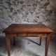 Old French table in cherry wood with bistro chair, circa 1900–1930.