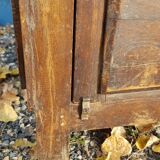 Glass-fronted entrance cabinet in Burmese teak