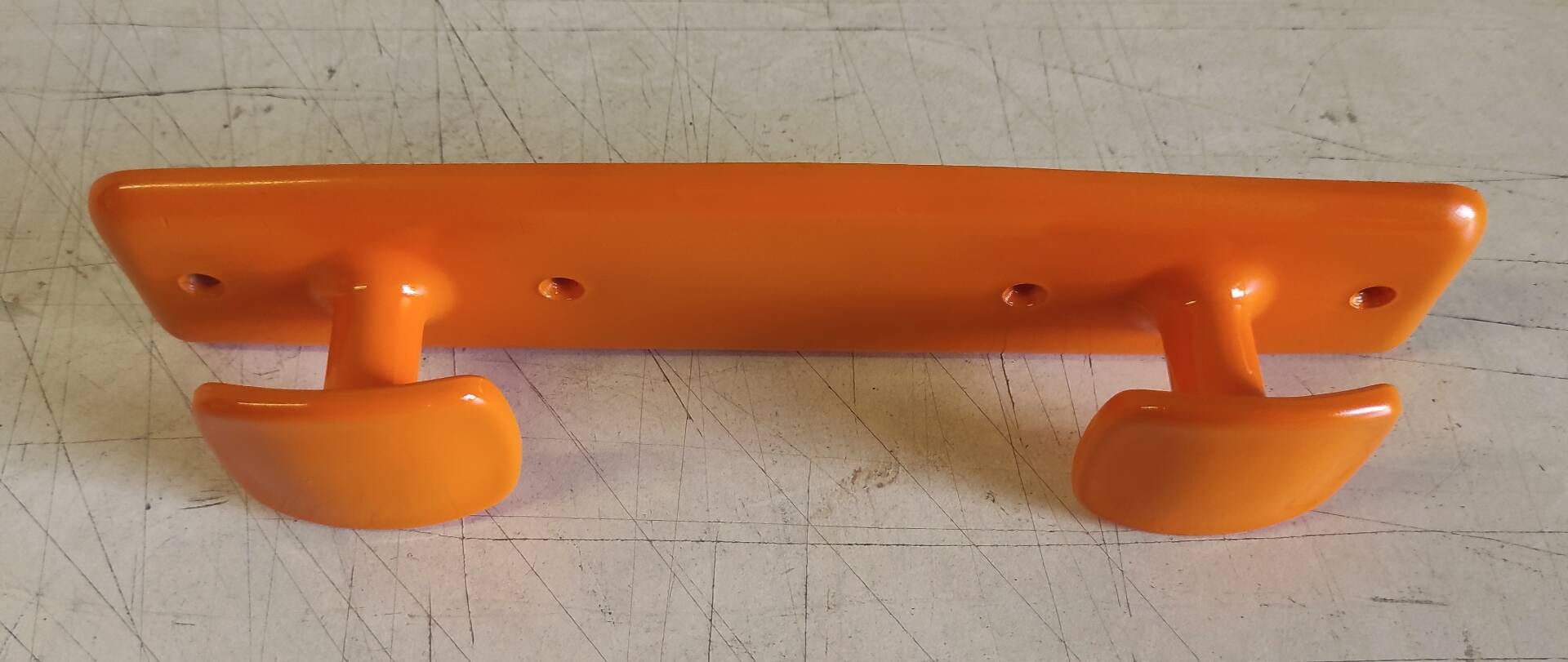 Orange plastic coat rack by Syla - 70's