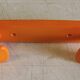 Orange plastic coat rack by Syla - 70's
