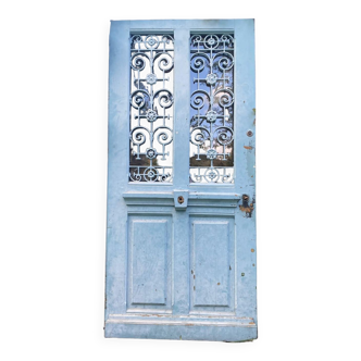 Entrance door in solid oak, cast iron grille, 1930s