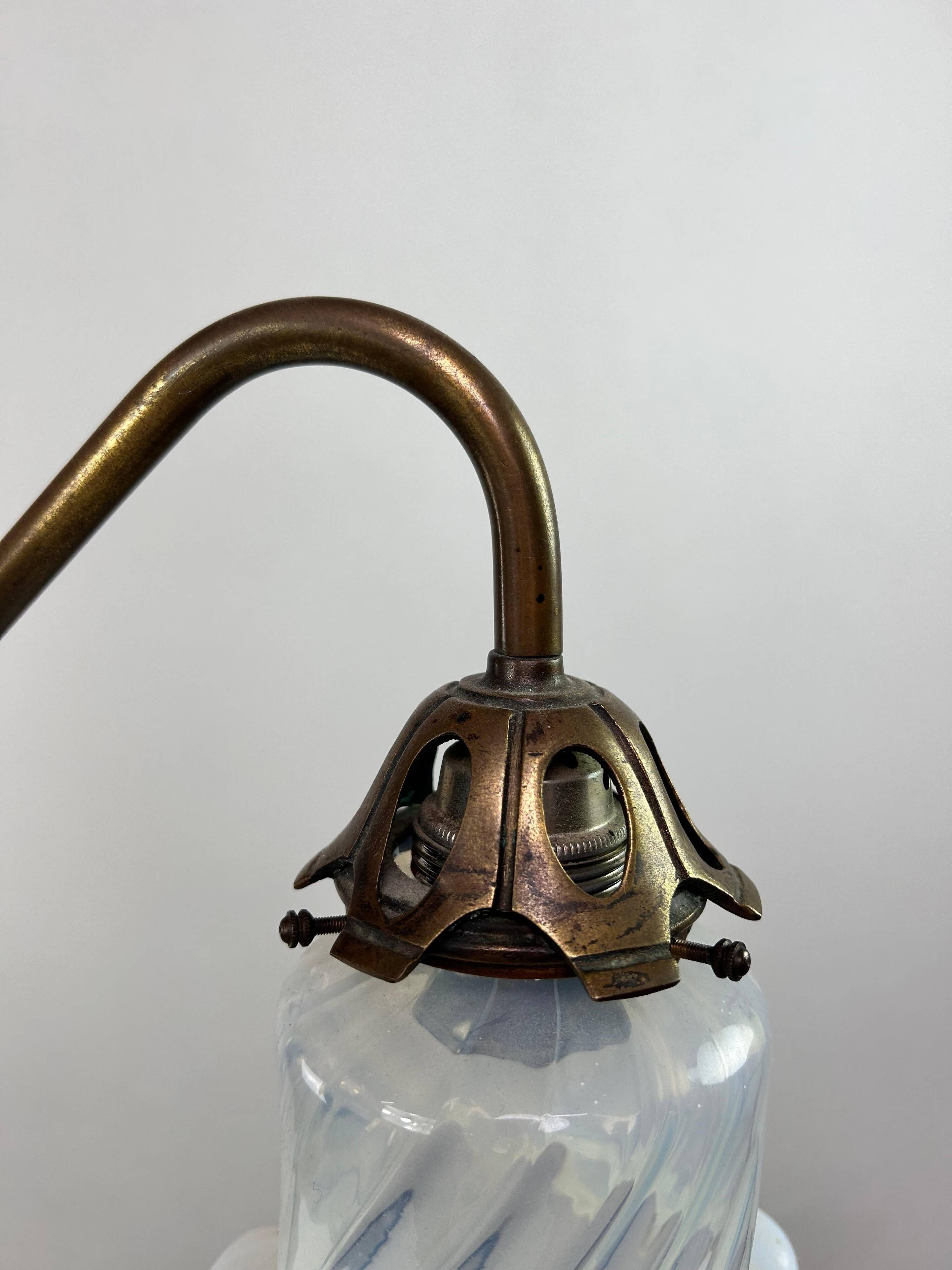Art Nouveau chandelier with three arms and opalescent iridescent glass.