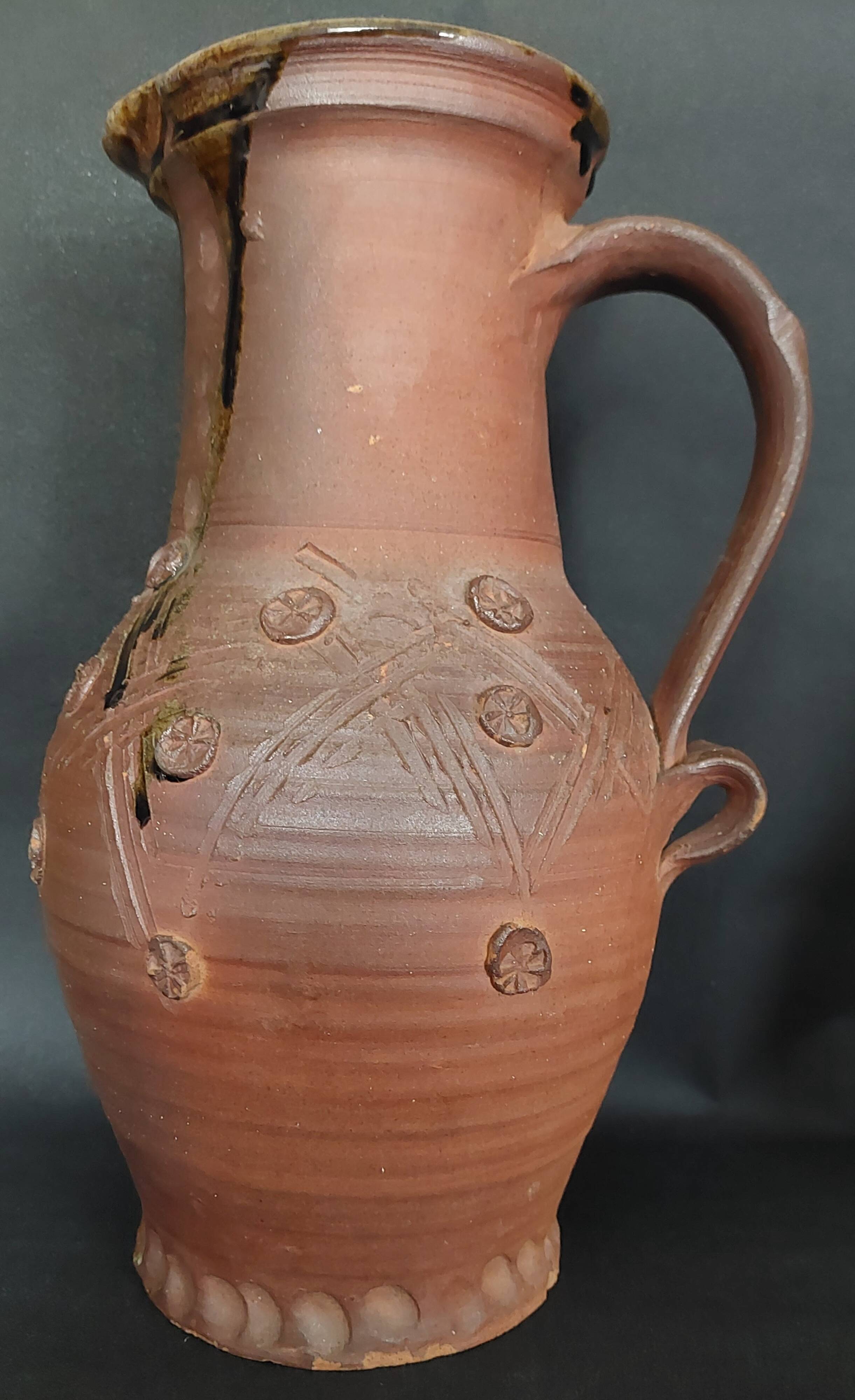 Vintage pitcher with a signature to identify.