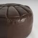 Pouf en cuir vintage