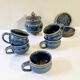 Part of a signed enameled stoneware coffee service