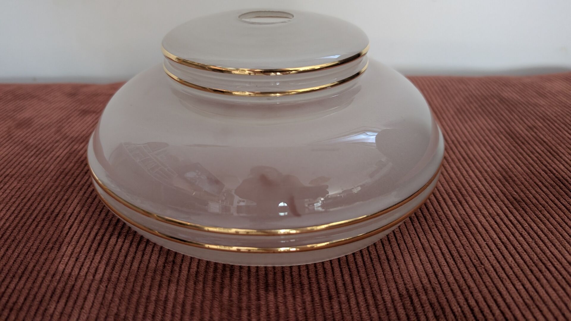 Vintage lamp made of turned wood, brass, and frosted glass.