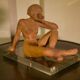 Terracotta sculpture of a seated woman by Norbert Treca contemporary art.