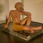 Terracotta sculpture of a seated woman by Norbert Treca contemporary art.