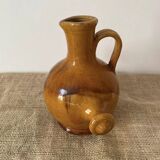 Provençal jug in orange/caramel glazed earthenware