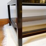 Black and gold coffee table with a double smoked glass top