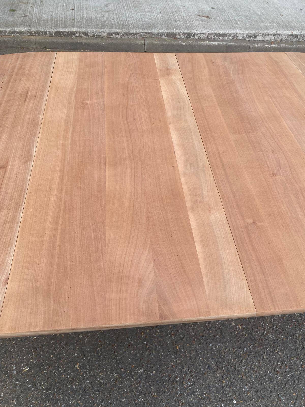Round extendable dining table stripped in solid cherry wood France 1950
