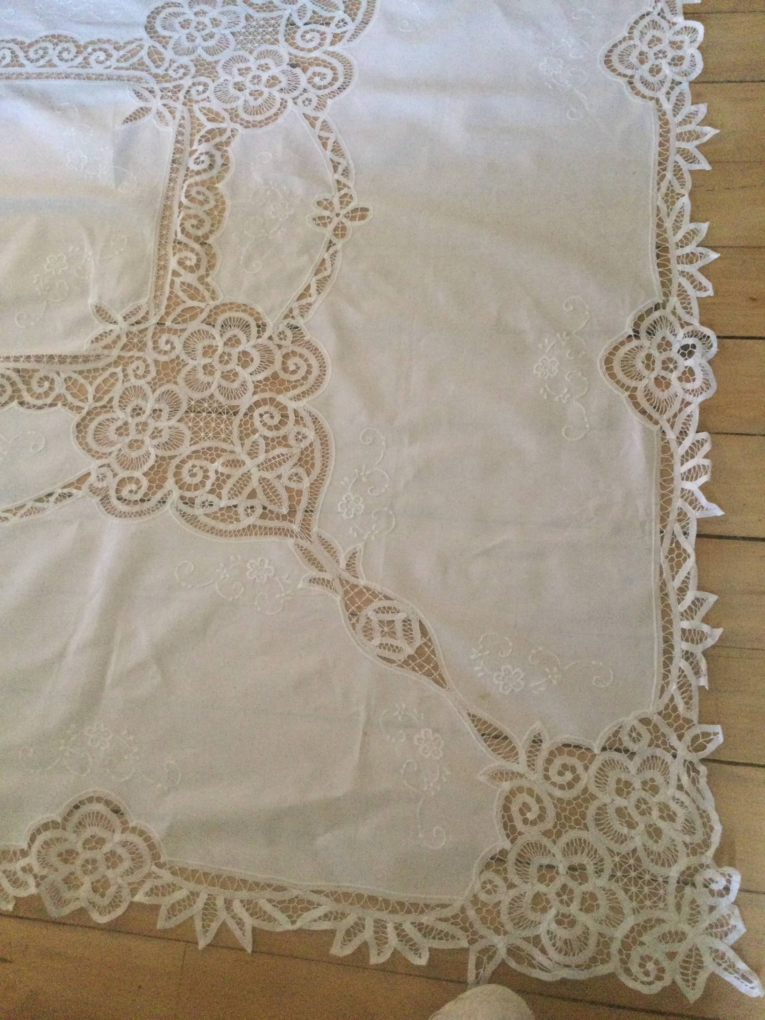 Embroidered white tablecloth and lace