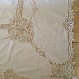 Embroidered white tablecloth and lace