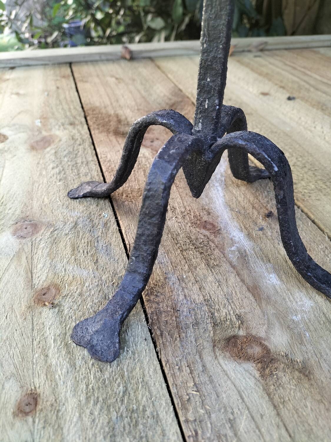 Brutalized wrought iron candle holder