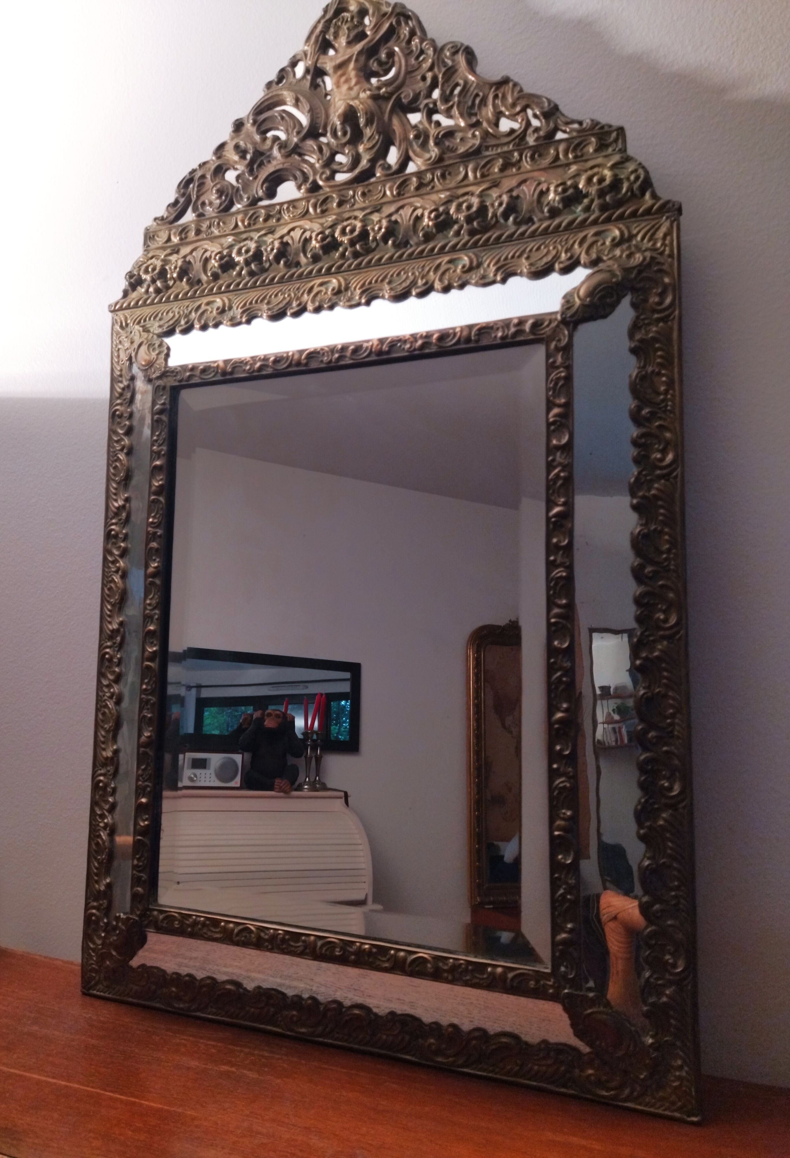 Repelled brass pareclose mirror