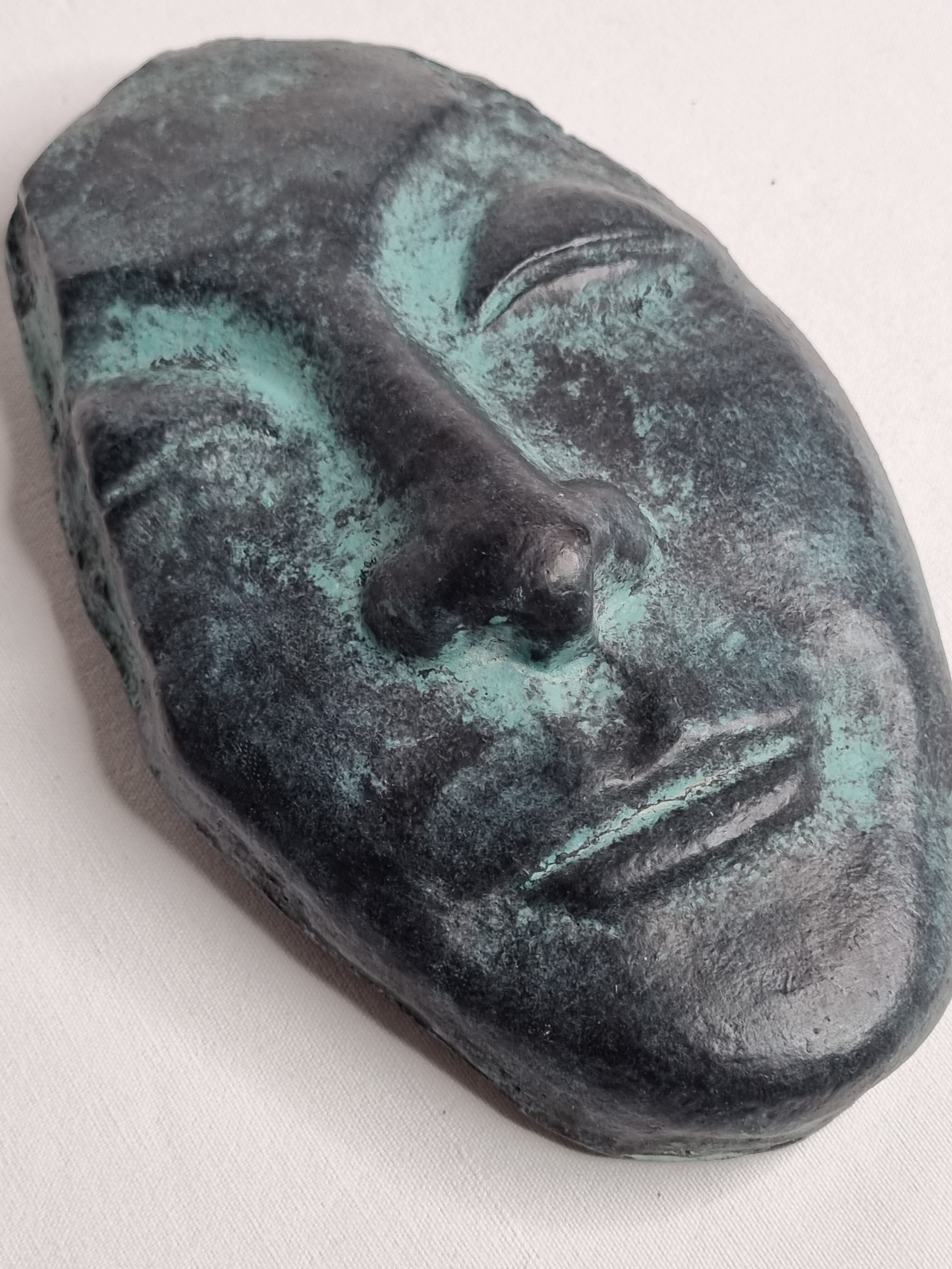 Patinated plaster replica of an ancient Greek face, signed
