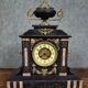 Large notary clock in black marble and gilded bronze.