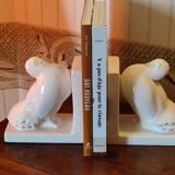 Pair of greenhouse art-deco books about cracked earthenware bird