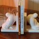 Pair of greenhouse art-deco books about cracked earthenware bird