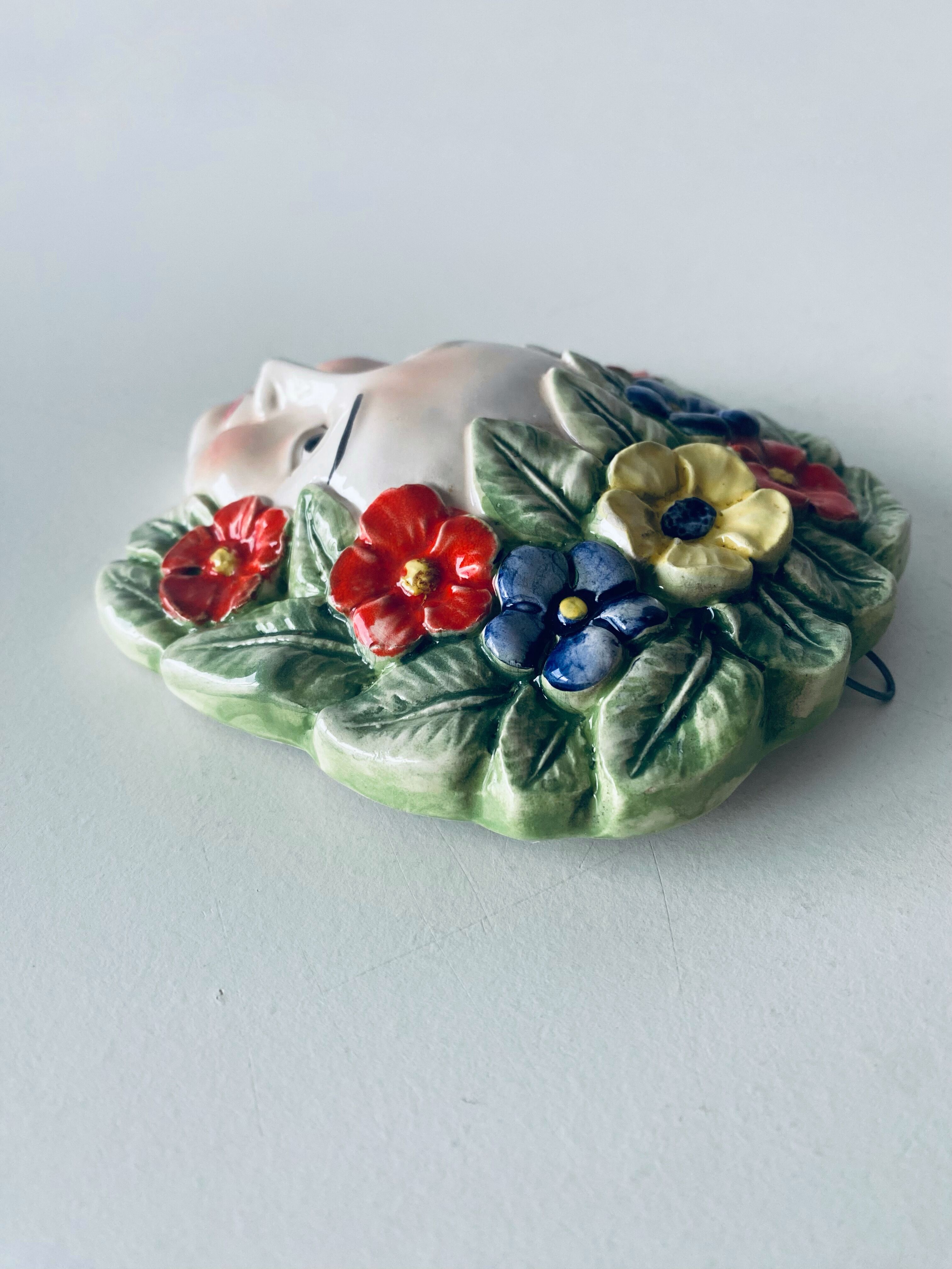 Ceramic wall face signed Il Falco