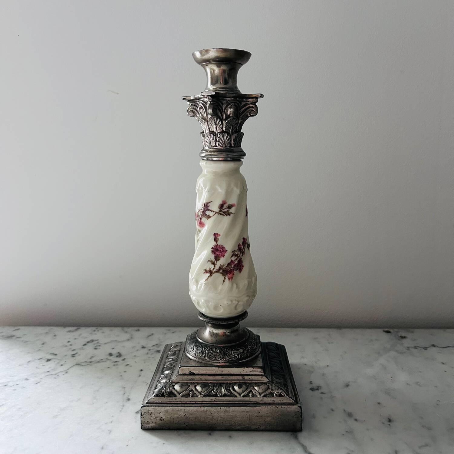 Silver-plated metal and porcelain candlestick