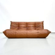 Three-seater Togo sofa in dark cognac leather by Michel Ducaroy for Ligne Roset.