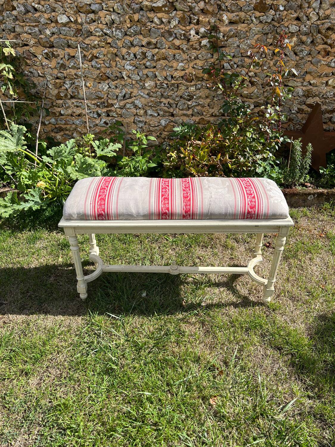 Louis XVI style bench at the end of the bed