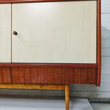Vintage row in lacquered wood and formica