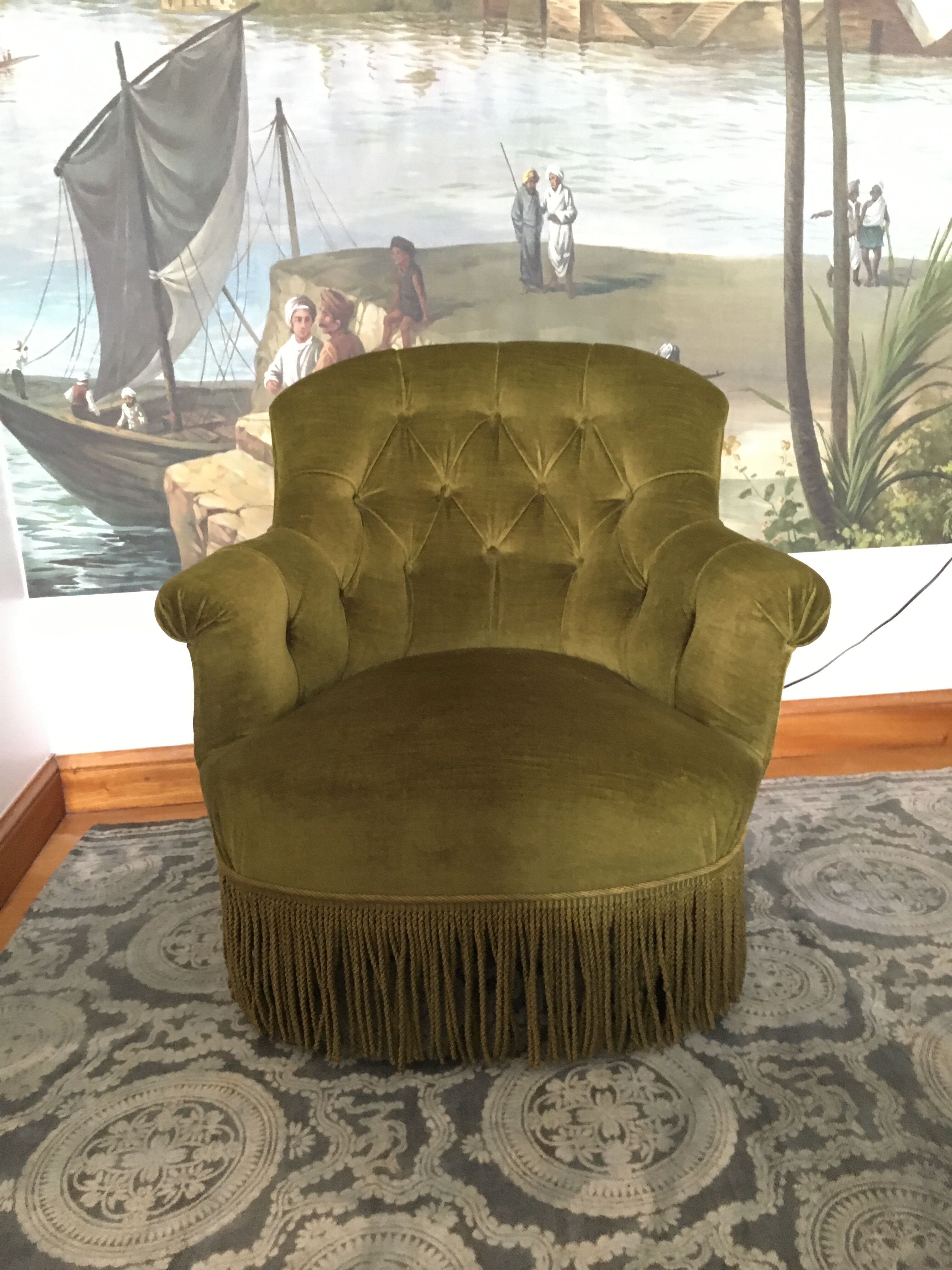 Old chair padded green velvet