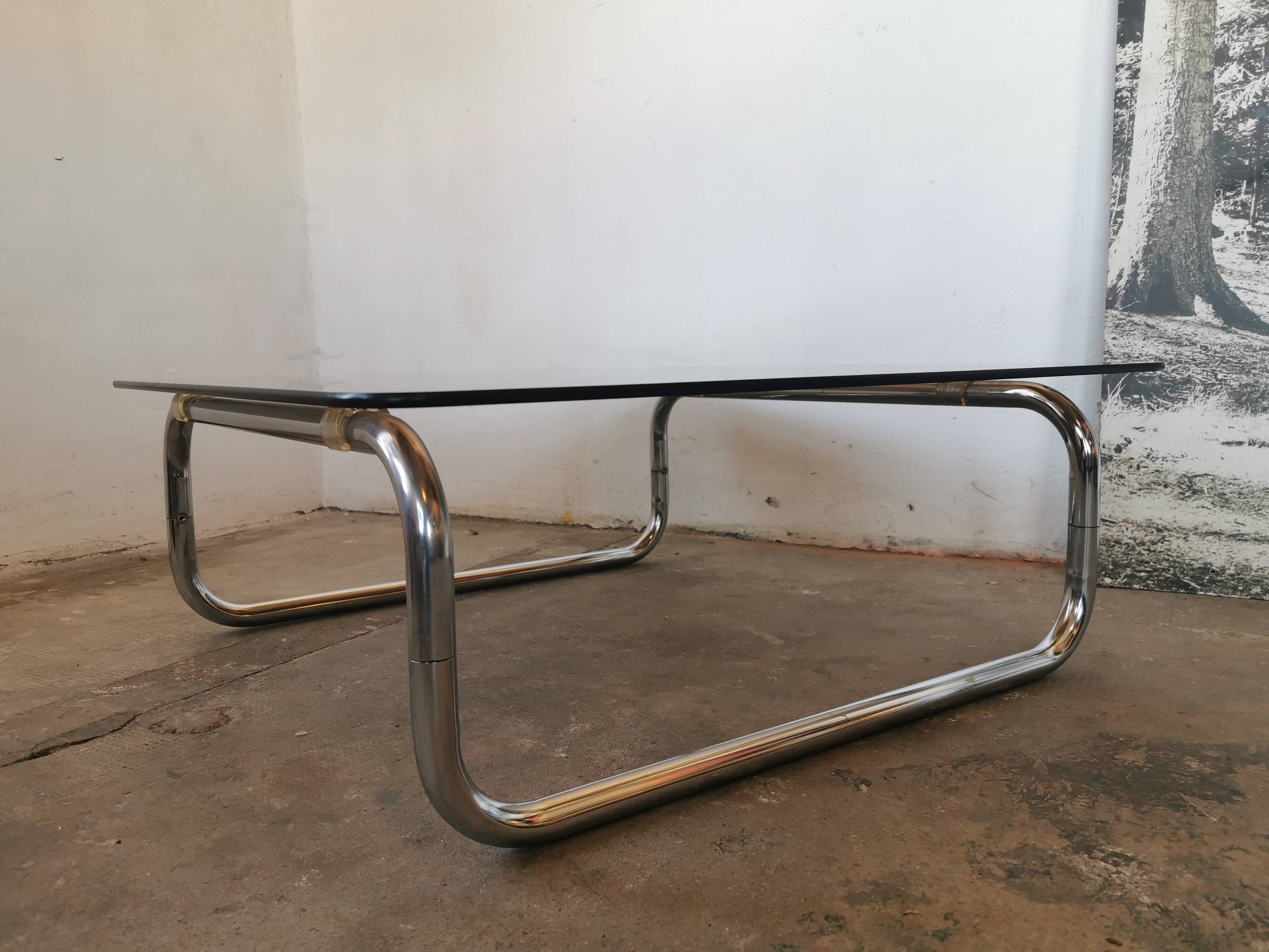 Chrome tubular metal and smoked glass coffee table