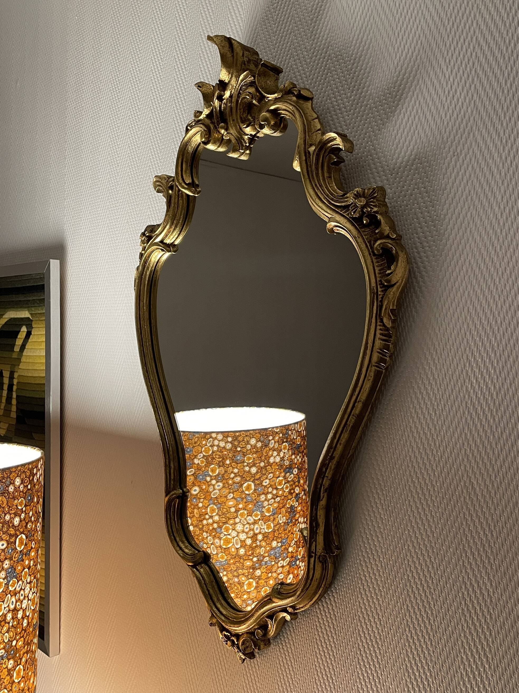 Old baroque style wall mirror with golden moldings
