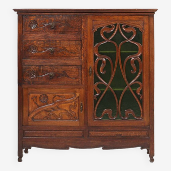 Remarquable armoire Art Nouveau en chêne avec porte vitrée verte et décor floral, France, 1910